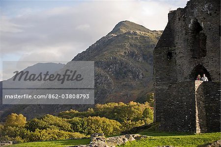 UK; North Wales; Snowdonia;  Couple sightseeing at Dolbadarn Castle, Llanberis.