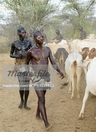 A Hamar woman being whipped by a man at a Jumping of the Bull ceremony.The