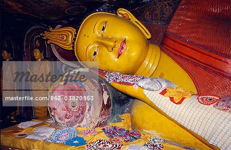 Sri Lanka, Dambulla Temple Complex.Reclining Buddha in one of the Dambulla Caves.Dambulla is a part of the Cultural Triangle declared by UNESCO is on the main road from Sigiriya to Kandy about 19Km from Sigiriya.