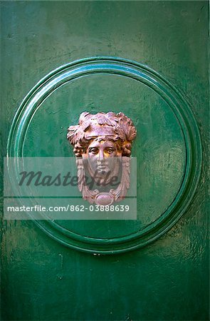 Rome, Italy; An ornamented door knob in the historical centre