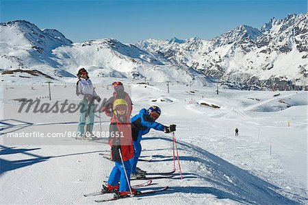Italy, Breuil-Cervinia, Cervinia Ski Resort. Family on the slopes of the Cervinia Ski Resort