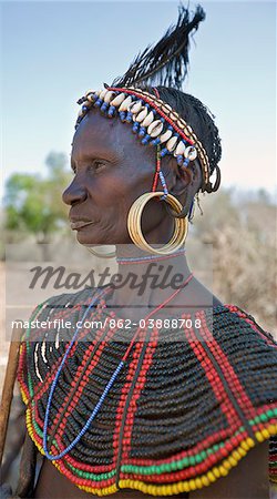 A striking old Pokot woman wearing the traditional beaded ornaments of her tribe which denote her married status. The Pokot are pastoralists speaking a Southern Nilotic language.