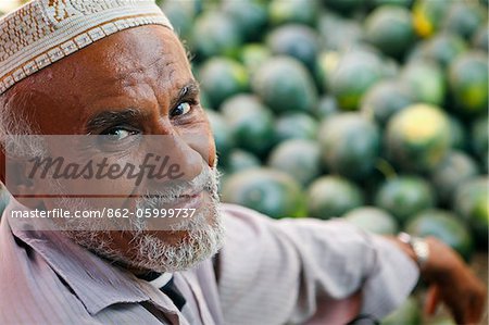 Yemen, Al Hudaydah, Bait Al Faqhi. A man sells watermelons at the Friday market.