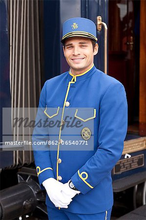A steward in his very smart uniform on the Venice Simplon Orient Express train, Innsbruck, Austria