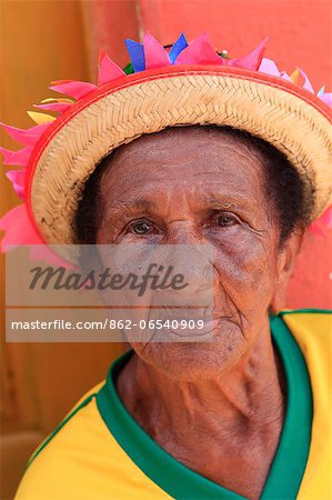 South America, Brazil, Maranhao, Sao Luis, Sao Jose de Ribamar, old lady reveller in a Brazilian football shirt at the Bumba Meu Boi celebrations in the streets of the town