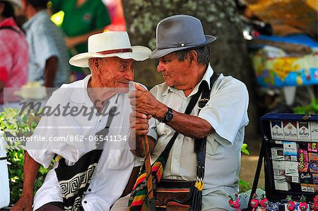 Two elderly men talking at Santa Fe de Antioquia, Colombia, South America