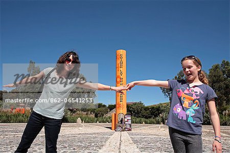 Holding hands across the equator, Cayambe, Ecuador