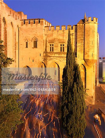 France, Provence, Avignon, Palais de Papes, Candlelit procession at dusk