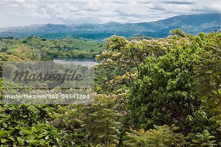 A magnificent view to the distant Rwenzori Mountains from the attractive gardens of Ndali Lodge, Uganda, Africa.