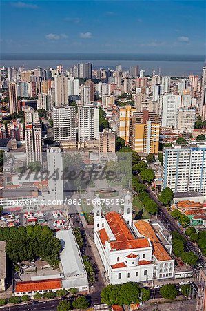 South America, Brazil, Para, Amazon, an aerial shot of the city of Belem in the southern mouth of the Amazon confluence, showing the basilica church of Our Lady of Nazareth, Basilica de Nossa Senhora de Nazare,, skyscraper apartment blocks and Guajara Bay