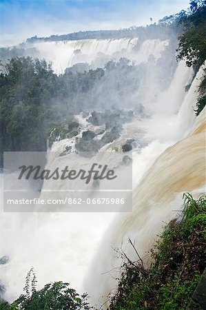 South America, Brazil, Parana, the Iguazu falls in full flood and lying on the frontier of Brazil and Argentina.