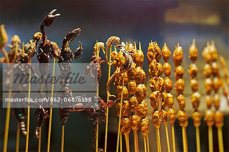 Deep fried snacks comprising seahorses, cicadas, and scorpions for sale in Snack Street, Wangfujing, Beijing, CHina