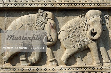 India, Madhya Pradesh, Maheshwar. High-relief caparisoned elephants form part of a frieze decorating the chhatri, or mausoluem, of Vitoji Rao Holkar.