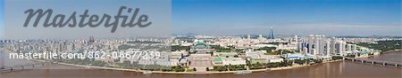 Democratic Peoples Republic of Korea. North Korea, Pyongyang. Elevated view of Pyongyang showing the Grand Peoples Study House, Kim Il Sung Square and the Taedong River.