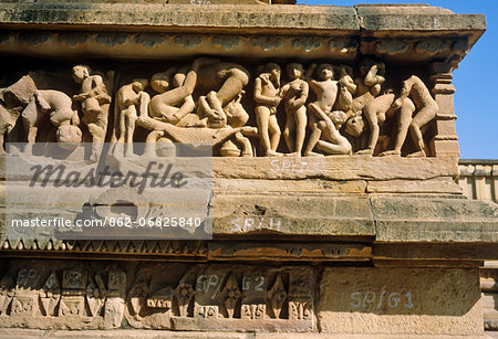 Asia, India, Madhya Pradesh, Khajuraho. Lakshmana temple, western temple group, frieze showing erotic sculptures. Asia, India, Madhya Pradesh, Khajuraho. Lakshmana temple, western temple group, frieze showing erotic sculptures.
