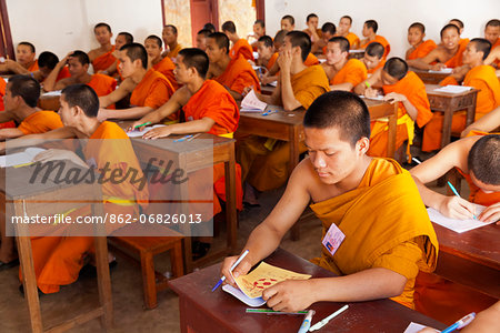 Laos, Luang Prabang. Monks studying hard.