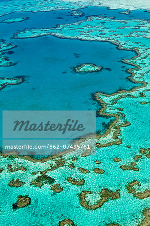 Australia, Queensland, Whitsundays, Great Barrier Reef Marine Park.  Aerial view of coral reef, including a heart-shaped formation, at Hardys Reef.