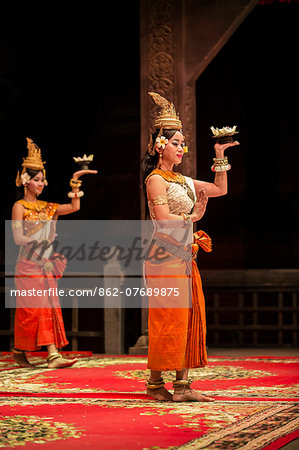 Cambodia, Siem Reap, Siem Reap Province. Cambodian women in traditional dress perform a classical dance of the Khmer with its origins in the royal courts.