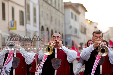 Italy, Tuscany , Pistoia. Trumpeters play a fanfare during the annual parade in the historic centre for the feast of San Jacopo.