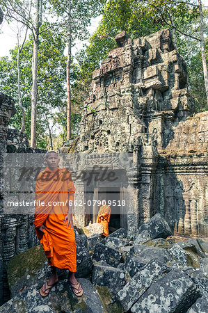 Cambodia, Siem Reap, Angkor Wat complex. monk inside Ta Nei temple (MR)