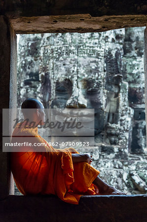 Cambodia, Siem Reap, Angkor Wat complex. Monks inside Bayon temple (MR) Cambodia, Siem Reap, Angkor Wat complex. Monks inside Bayon temple (MR)