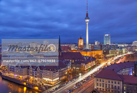 Berlin Mitte, the central distric of Berlin with the 368m tall TV tower seen from Fischerinsel at dusk. Berlin Mitte, the central distric of Berlin with the 368m tall TV tower seen from Fischerinsel at dusk.