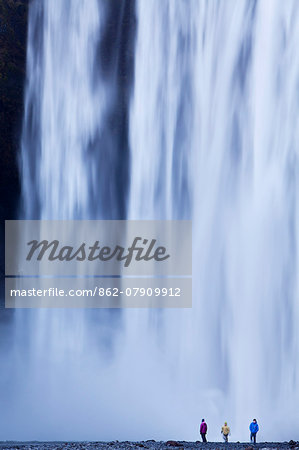 Iceland, Skogafoss. The 62m high waterfall of Skogafoss topples over a rocky cliff at the western edge of Skogar.