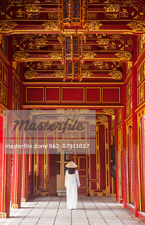 Woman wearing Ao Dai dress in Imperial Palace inside Citadel, Hue, Thua Thien-Hue, Vietnam (MR) Woman wearing Ao Dai dress in Imperial Palace inside Citadel, Hue, Thua Thien-Hue, Vietnam (MR)