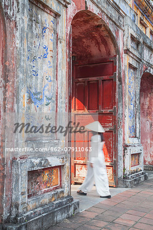 Woman wearing Ao Dai dress at Dien Tho inside Citadel, Hue, Thua Thien-Hue, Vietnam (MR)