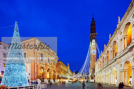 Europe, Italy, Veneto, Vicenza, Christmas decorations in Piazza Signori, clock tower on the Basilica Palladiana, Unesco World Heritage Site