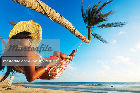 South East Asia, Philippines, The Visayas, Cebu, Bantayan Island, Sugar Beach, girl relaxing on the beach (MR)