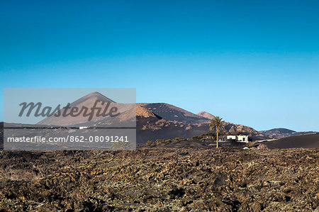 House in volcanic landscape, Parque de los Volcanes, Lanzarote, Canary Islands, Spain