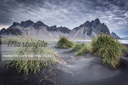 Iceland, Vestrahorn mount and black sand beach in foreground, near Vik