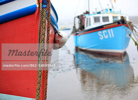 England, Cornwall, Isles of Scilly. Colourful boats in the harbour at Hugh Town on St Marys island.