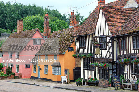 England, Suffolk, Kersey. Pub and colourful cottages in the village.