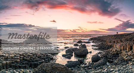 Giant's Causeway, County Antrim,  Ulster region, northern Ireland, United Kingdom. Panoramic view of the iconic basalt columns at dusk