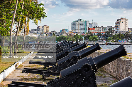 Cuba, Havana, Parque Historico Militar Morro-Cabana. Rows of old canons on the battlements of two forts guarded HabanaVieja from attack between the 16th and 19th centuries.