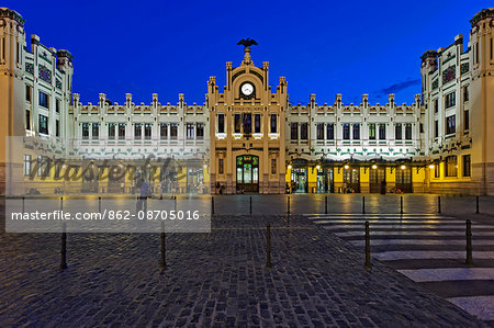 The front facade of the Estacio del Nord railway Station in Valencia at twilight, Xativa - Marques de Sotelo, Valencia, Comunidad Valenciana, Spain.