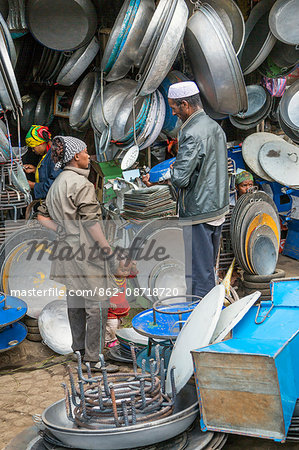 Ethiopia, Addis Ababa, Mercato.  A roadside stall in the sprawling Mercato market displays pots, trays and pans made from recycled material. Almost every conceivable old or discarded item is recycled there.