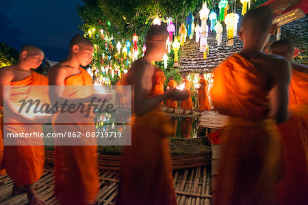 South East Asia, Thailand, Chiang Mai, Wat Phan Tao temple, monks celebrating Loi Kratong festival