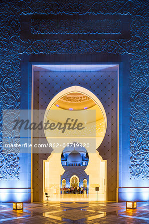 United Arab Emirates, Abu Dhabi. The main entrance to Sheikh Zayed Grand Mosque. Completed in 2007 the mosque can hold over 40,000 worshippers and is made up of 82 domes and four 107m high minarets.