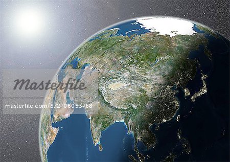 Globe Showing Asia, True Colour Satellite Image. True colour satellite image of the Earth showing Asia, half in shadow, and the sun. This image in orthographic projection was compiled from data acquired by LANDSAT 5 & 7 satellites.