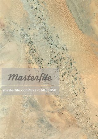 Agriculture In The Desert, Riyadh Province, Saudi Arabia, True Colour Satellite Image. True colour satellite image of agriculture in the desert in the Riyadh Province, Saudi Arabia, about 250 km west of the Saudi capital, Riyadh. Circular agricultural plots are visible on the image. Composite image using LANDSAT 7 data.