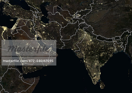 Middle East and India at night in 2012. This satellite image with country borders shows urban and industrial lights.