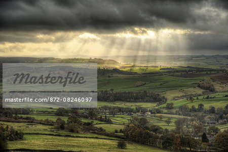 Sunbeams over Big Moor in the Peak District in Autumn.