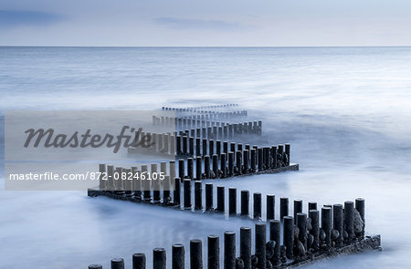 A metal groyne zig zags into the sea on Caister beach. A metal groyne zig zags into the sea on Caister beach.