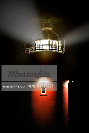 Light beams from lantern of the Cocksdorp lighthouse Eierland at night