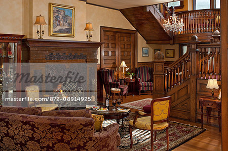 Living Room With Fireplace And Wooden Staircase Albemarle Inn