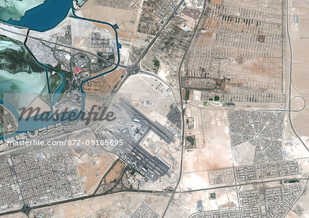 Color satellite image of Abu Dhabi International Airport, United Arab Emirates. The amusement park Ferrari World Abu Dhabi is on Yas Island, at center left on the image. Image collected on September 21, 2017 by Sentinel-2 satellites.