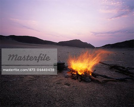 Campfire near Messum Crater at Dusk, Brandberg, Namibia, Africa